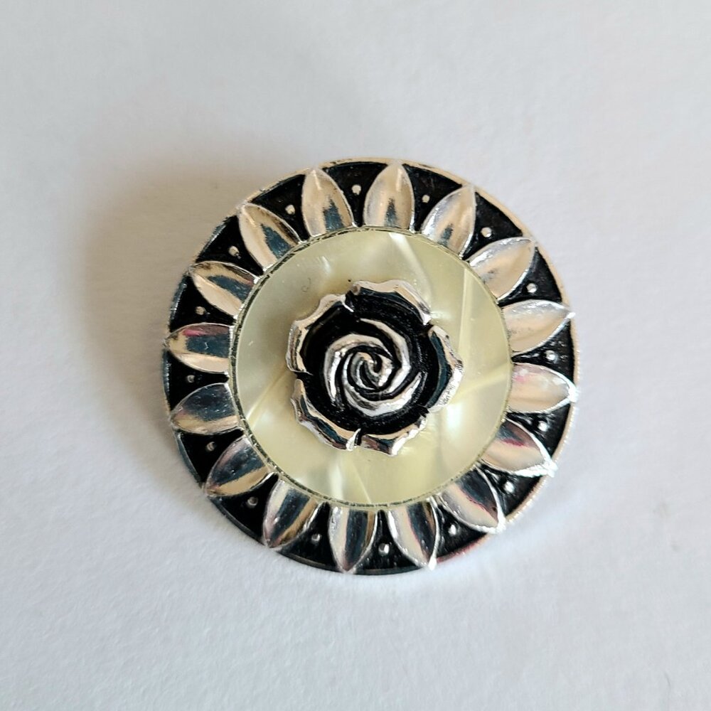 Vintage 1980's round black and silver scarf clip.